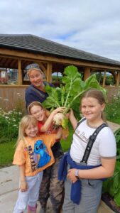 Children proud of the veg they harvested